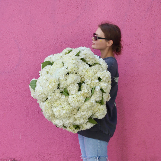 White Cloud floral arrangement from Pink Clover LA, styled with fresh blooms and calming tones