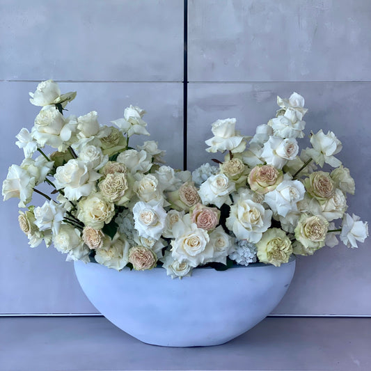 Luxurious white and beige rose arrangement styled in a minimalist gray vase, perfect for upscale gifting and Los Angeles flower delivery