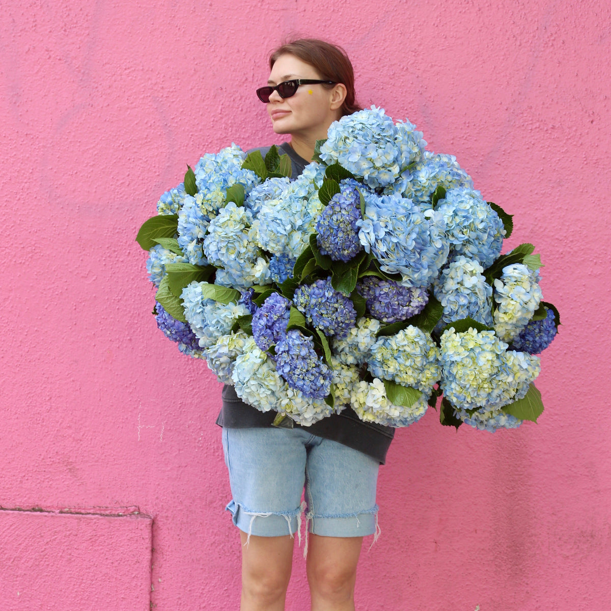 Sapphire Dreams floral arrangement from Pink Clover LA, styled with lush greenery and calming tones