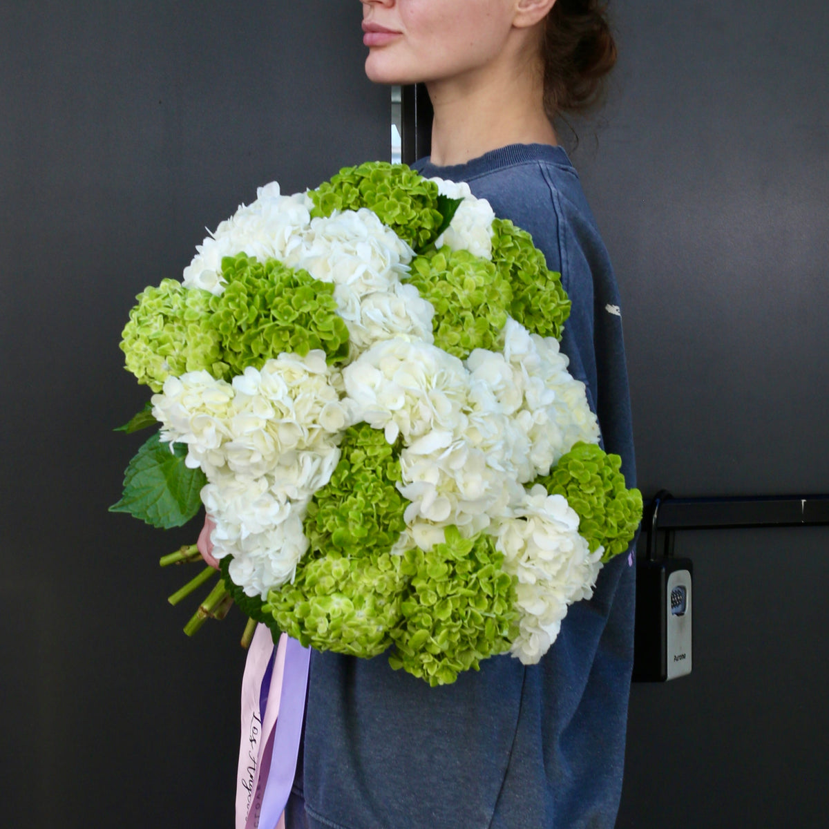 Elegant bouquet of green blooms with soft seasonal accents, ideal for serene celebrations