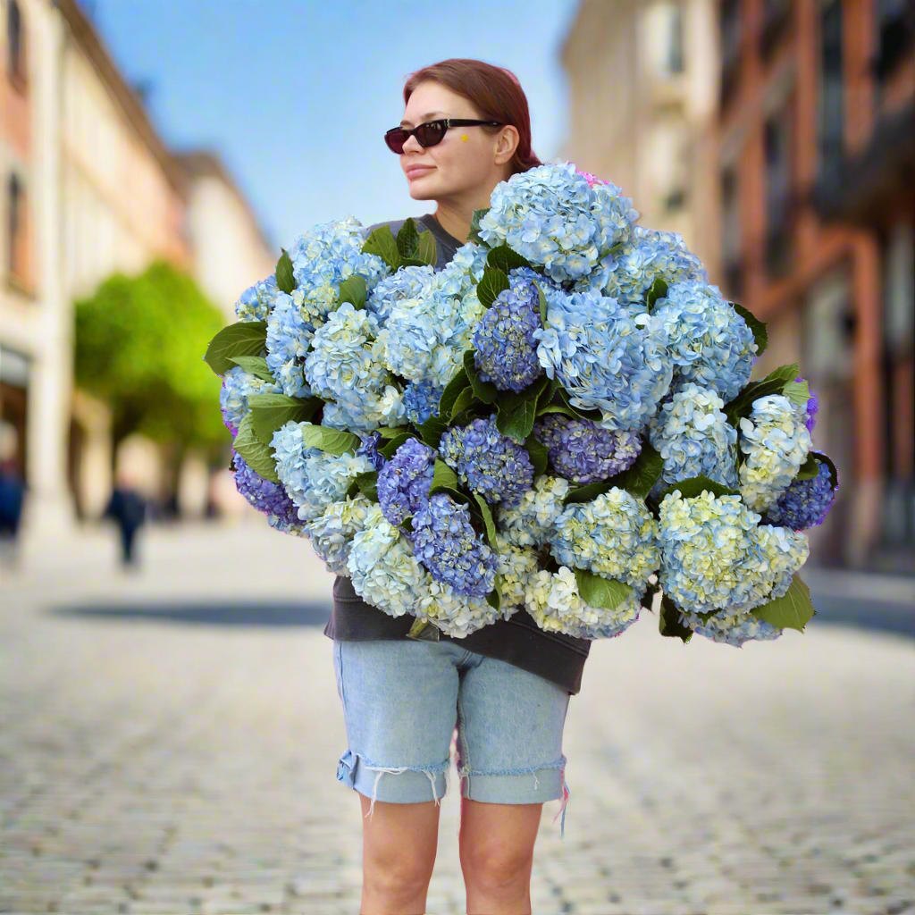 Elegant bouquet of blue delphiniums and white roses, ideal for serene celebrations