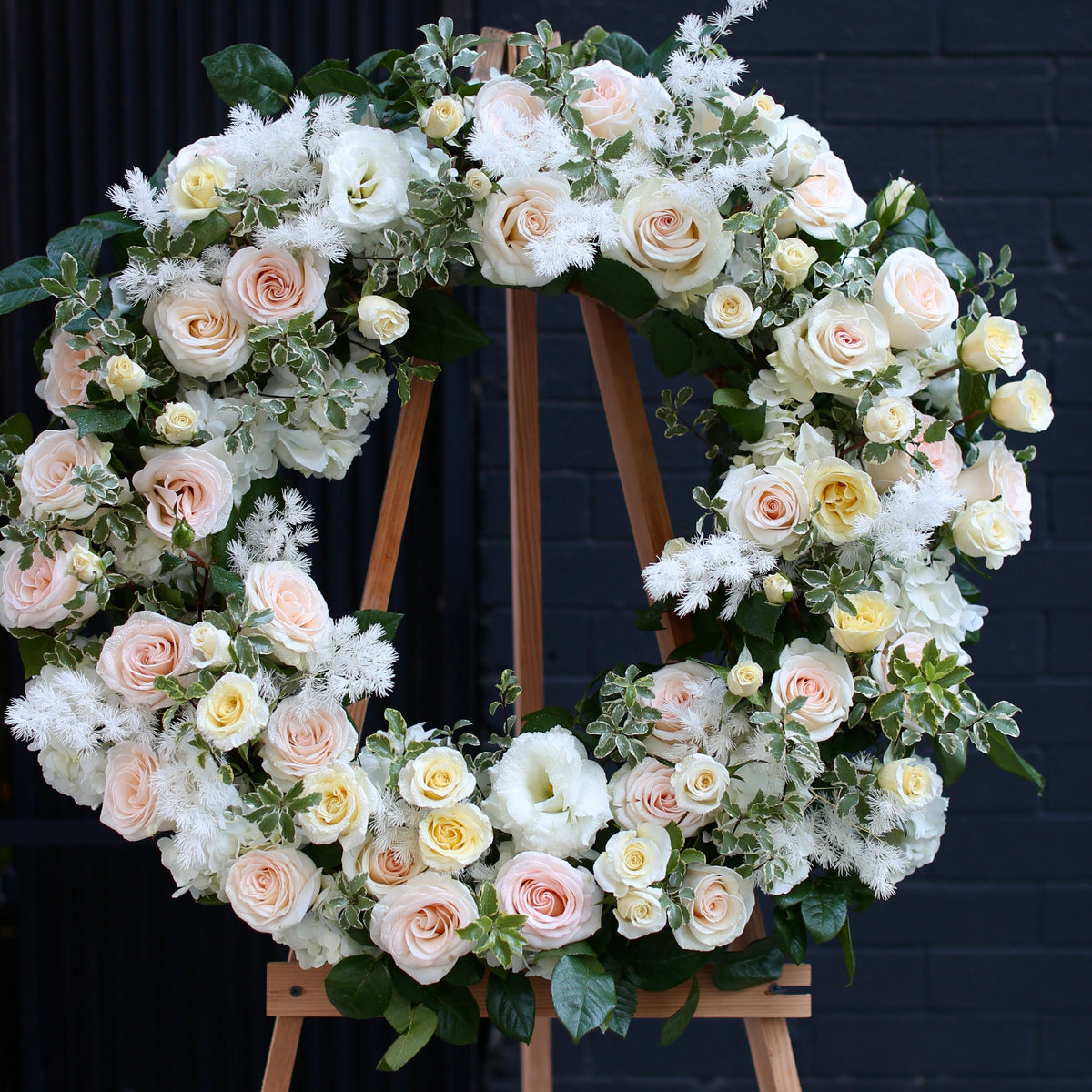 Loving Tribute bouquet from Pink Clover LA, featuring delicate blooms and green accents
