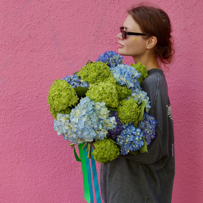 Handcrafted bouquet featuring blue and white blooms, perfect for tranquil decor