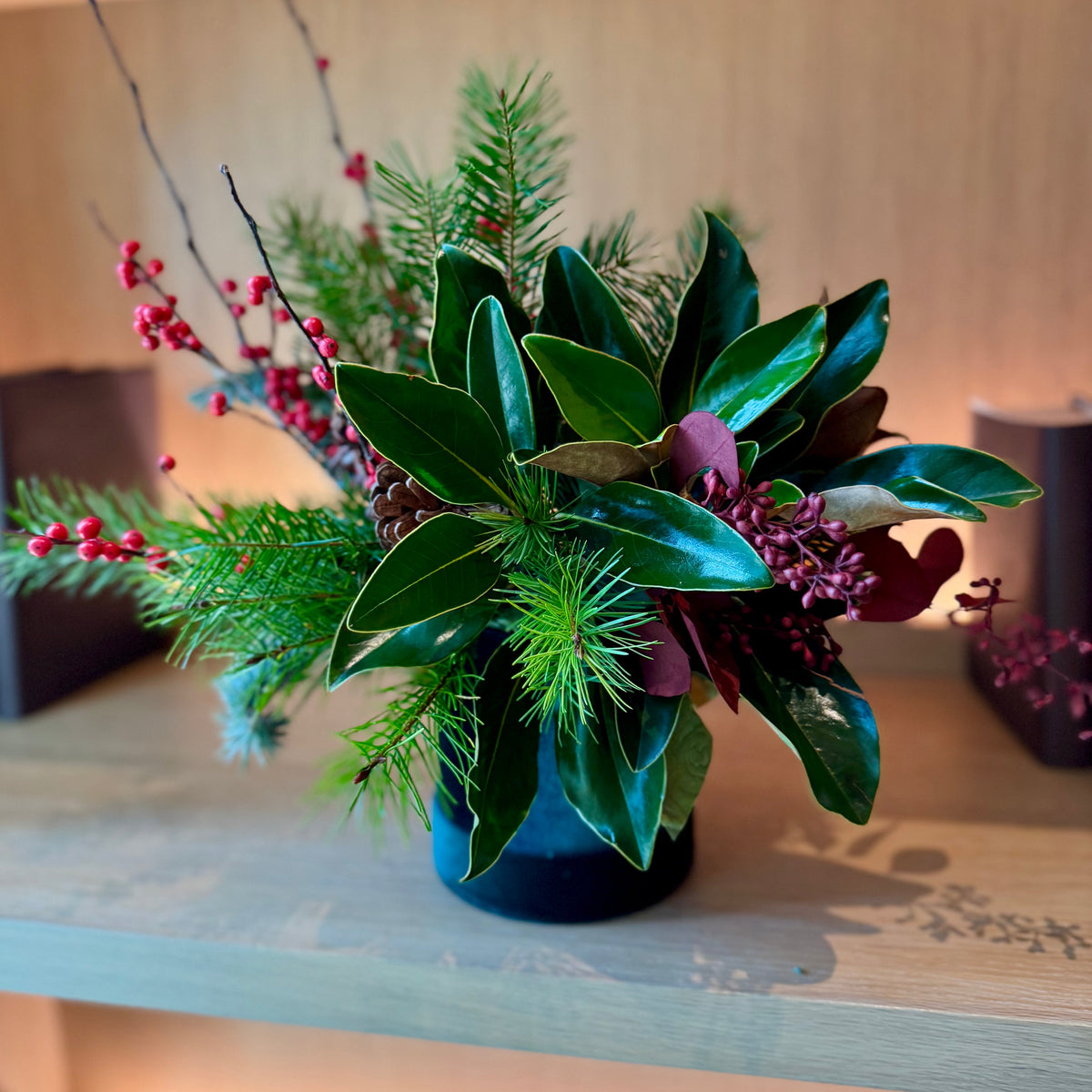 Elegant bouquet of seasonal greenery with festive accents, ideal for winter celebrations