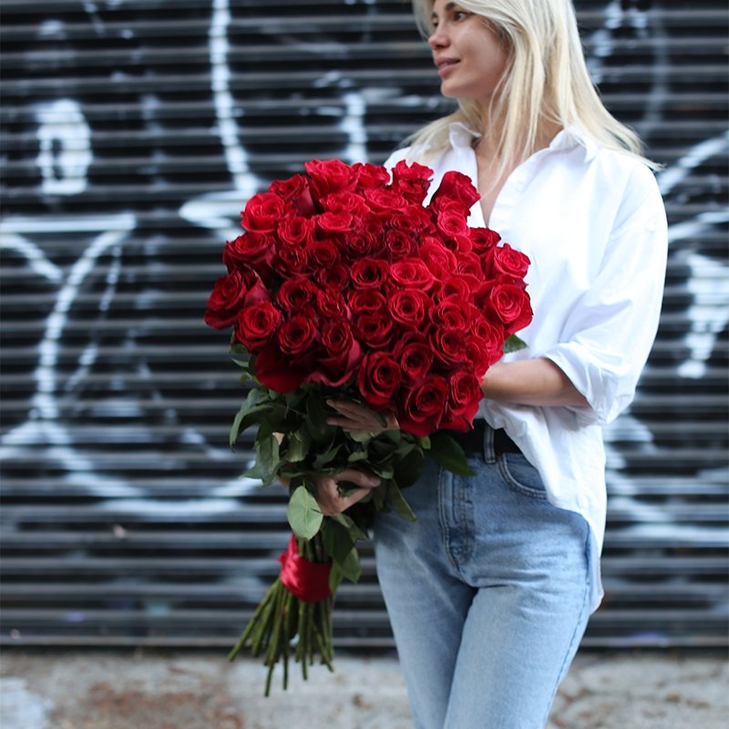 Handcrafted bouquet of hot red roses showcasing premium quality and vibrant color, styled for a striking visual impact