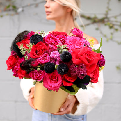 Luxurious Halloween bouquet featuring red roses, purple chrysanthemums and velvet pumpkins in a decorative gold pumpkin box