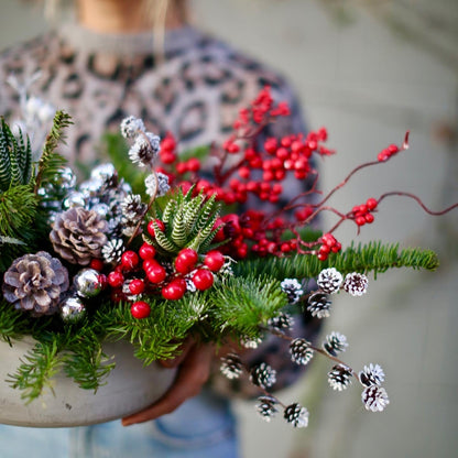 Elegant Winterberry bouquet with red berries and decorative succulents, beautifully presented for premium delivery