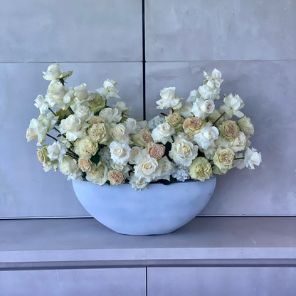 Elegant Majestic bouquet showcasing white and beige roses beautifully arranged in a modern gray vase for premium floral delivery