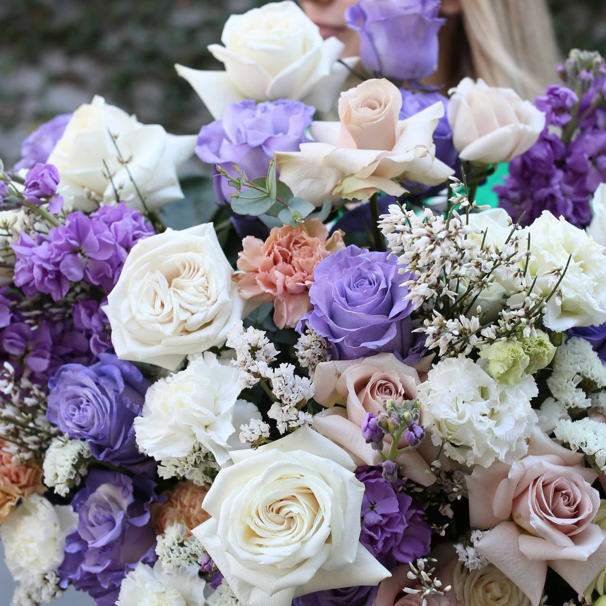 Soft and soothing bouquet featuring gentle pinks and greens, styled in a modern, flowing composition