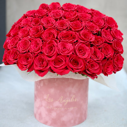 Premium floral gift featuring a velvet box with 50 red roses, styled for grand romantic occasions and luxury delivery