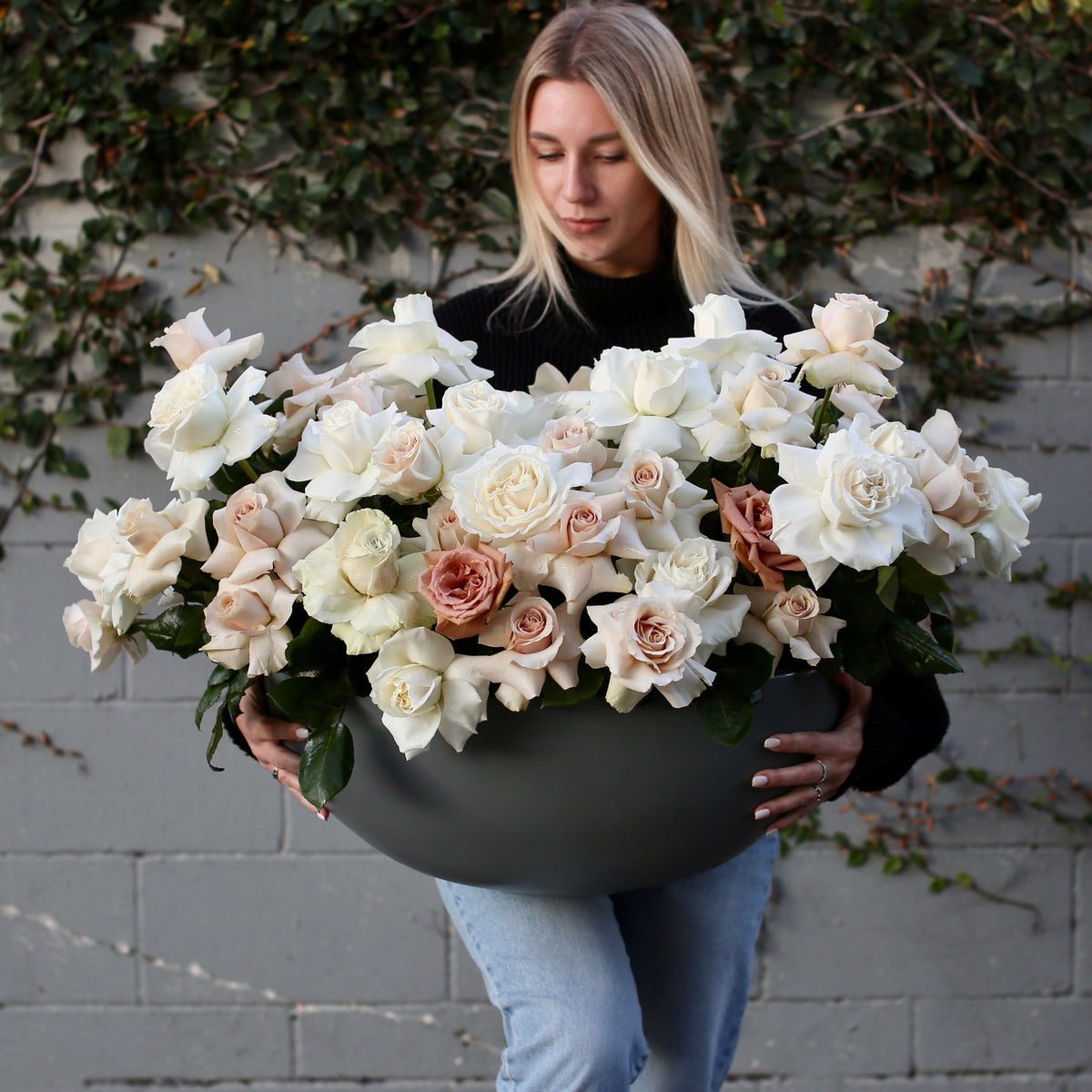Handcrafted Majestic floral gift with soft-toned roses in a sophisticated vase presentation, beautifully styled for luxury home décor and celebrations