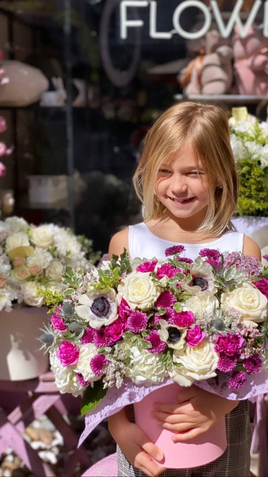 Luxurious Loli bouquet styled in soft pink and blue tones, perfect for romantic occasions and upscale floral delivery