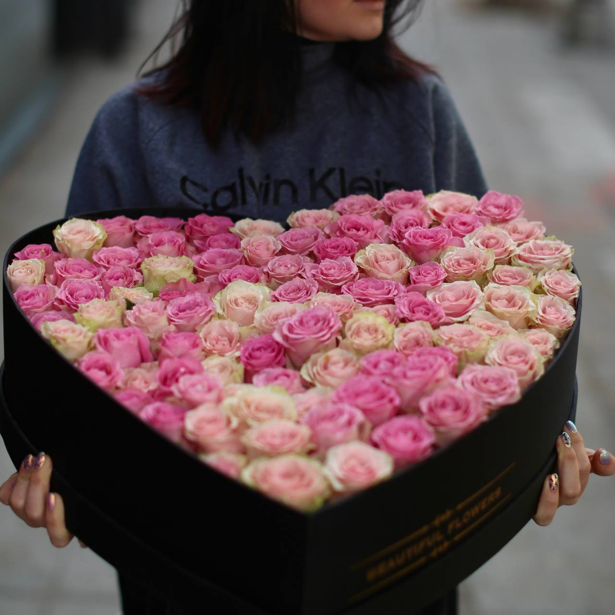 Luxurious bouquet of red roses symbolizing romance and devotion, elegantly wrapped for gifting