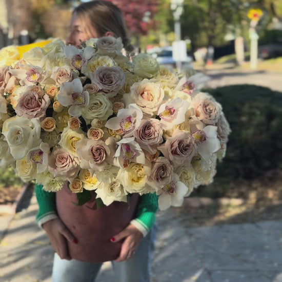 Premium white flower arrangement showcasing pristine blooms in a minimalist yet luxurious presentation
