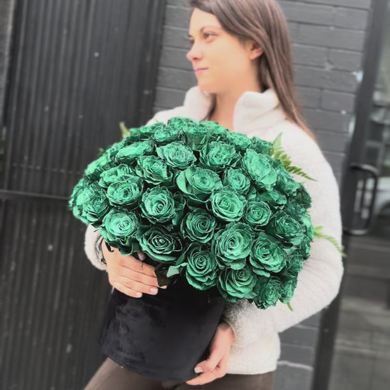 Full view of the Green Roses in Black Velvet Box, styled against a dark backdrop to emphasize the rich color and premium presentation.
