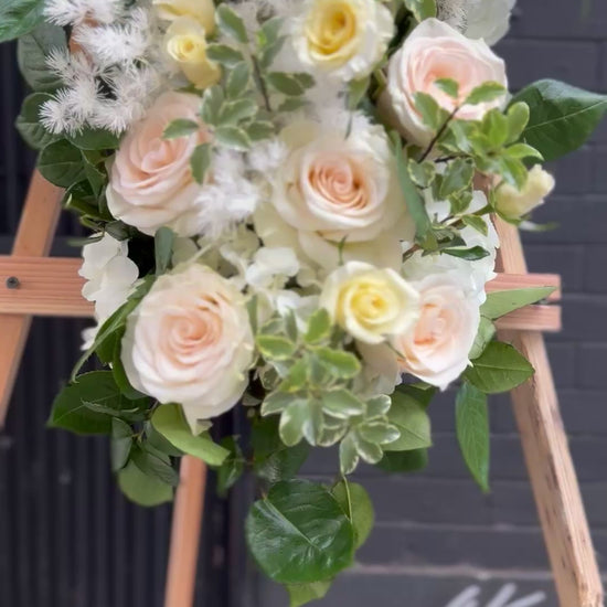 Handcrafted sympathy bouquet with serene white lilies, ideal for honoring cherished memories