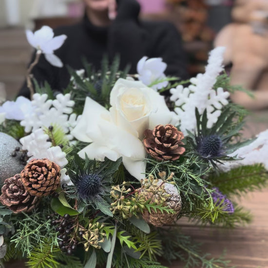 Luxurious Christmas flower design in white and green tones, ideal for seasonal gifting and holiday decor