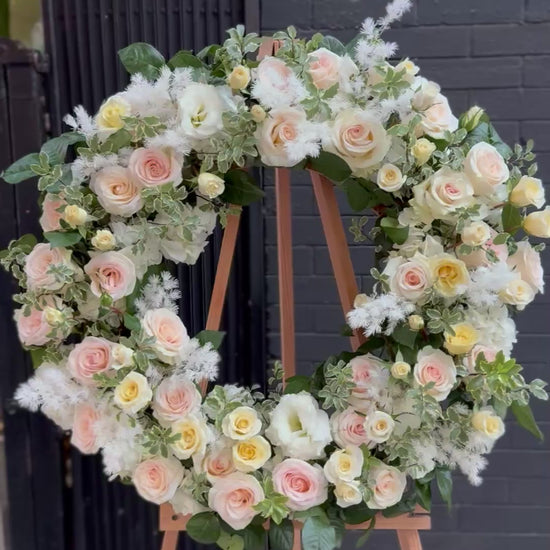 Loving Tribute bouquet from Pink Clover LA, featuring delicate blooms and green accents